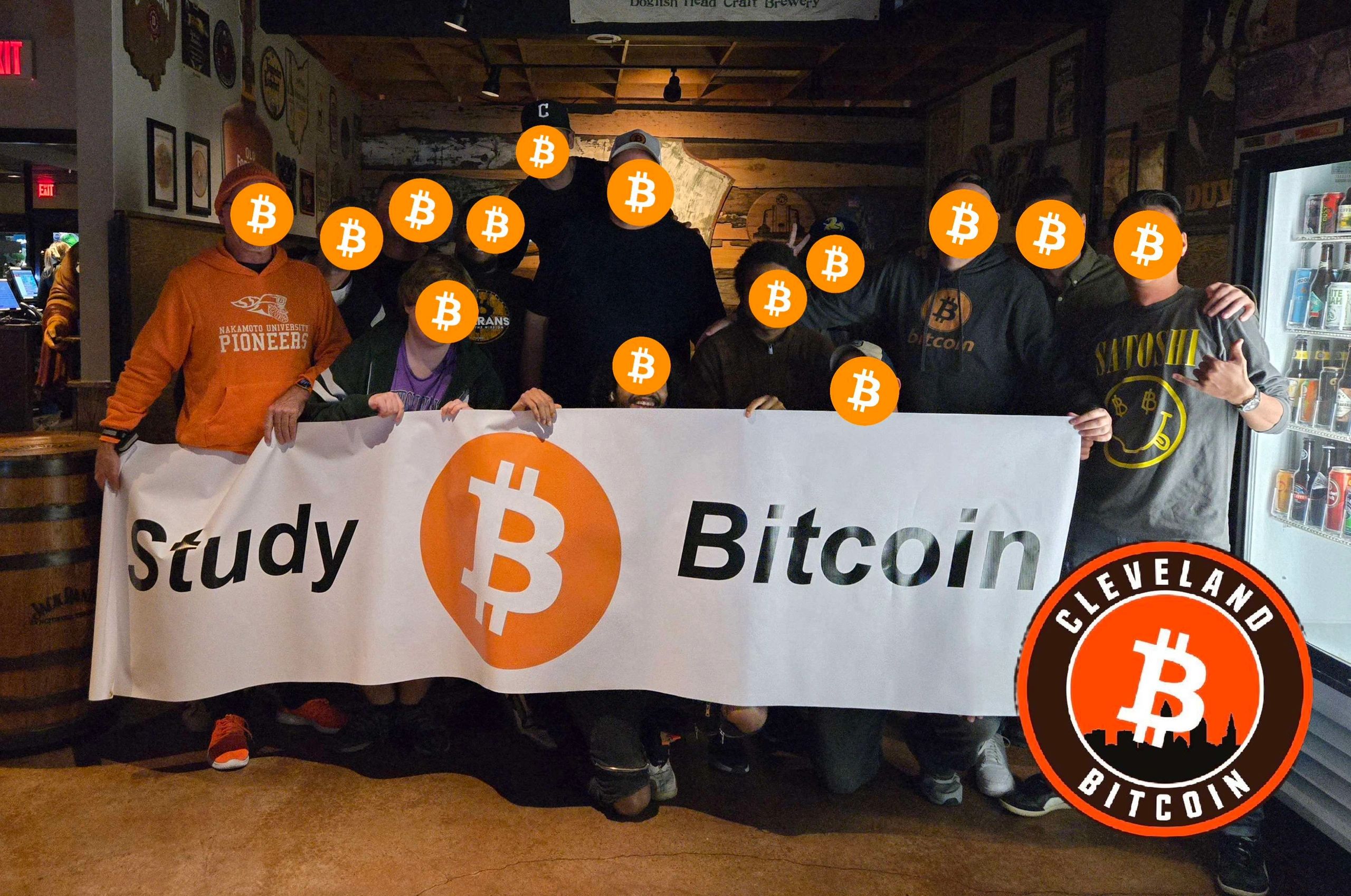 Cleveland Bitcoin meetup group holding a Study Bitcoin banner